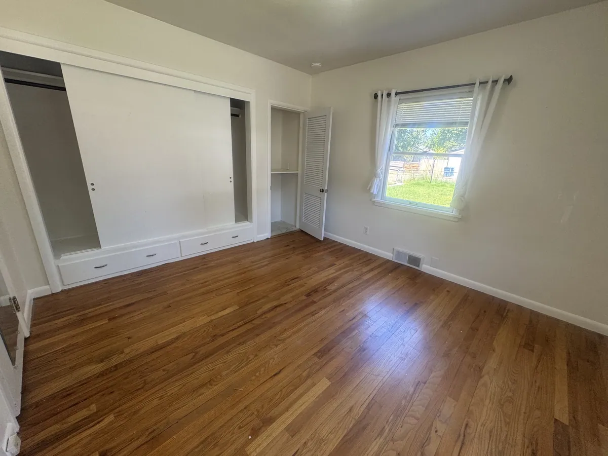 Main floor bedroom by Saved X Grace Construction in Missoula, MT