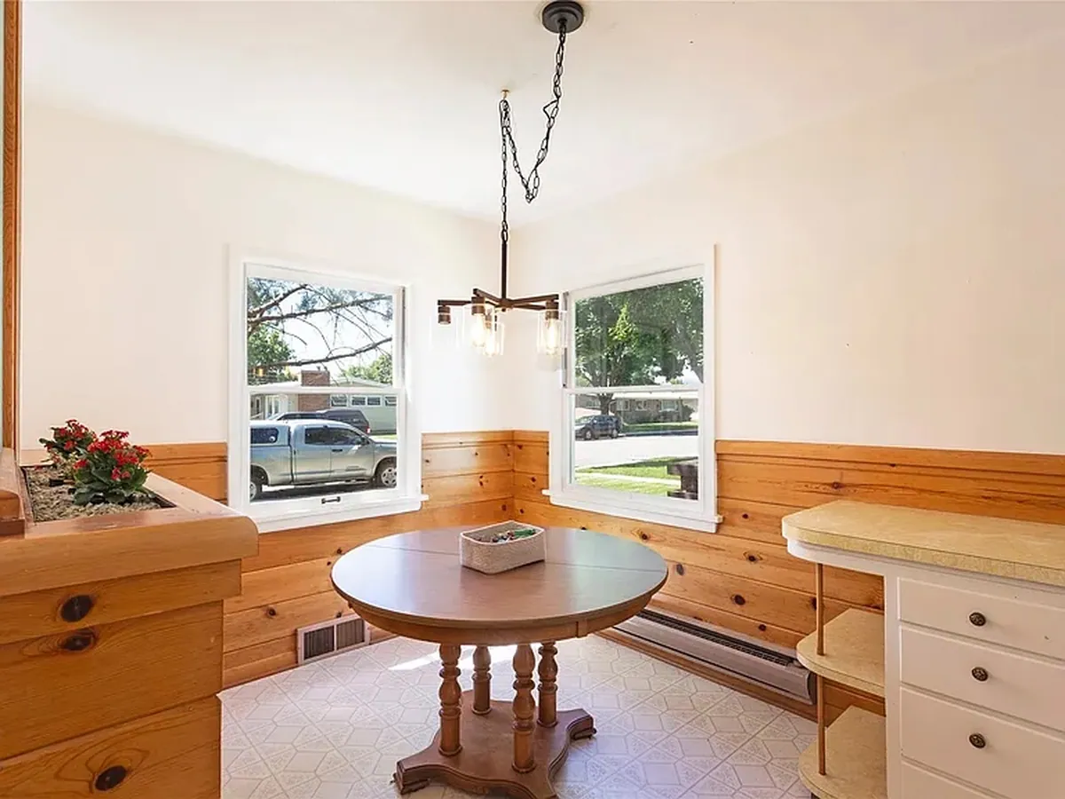 Dining area after renovation by Saved X Grace Construction