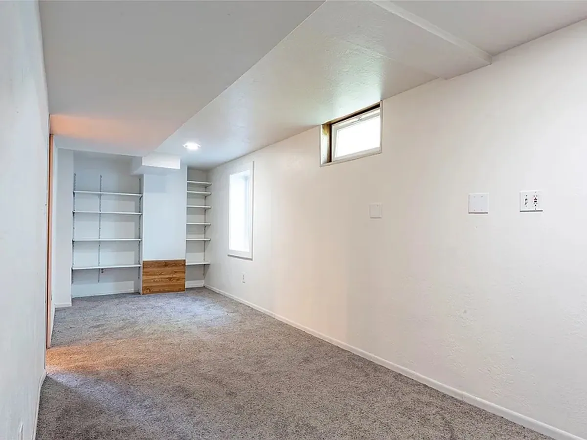 Lower level den after renovation by Saved X Grace Construction