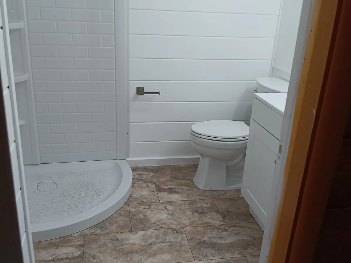 Close finish detail in a completed bathroom remodel
